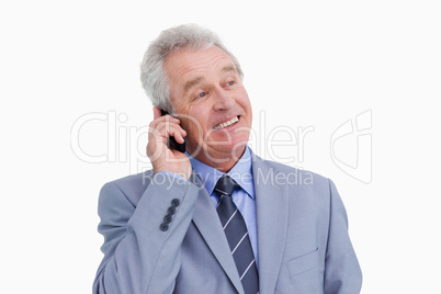 Close up of mature cheerful tradesman on his cellphone