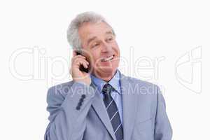 Close up of mature cheerful tradesman on his cellphone