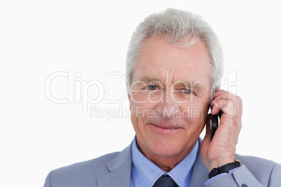 Close up of mature tradesman on his cellphone