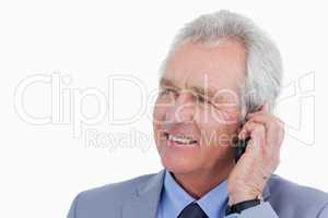 Close up of mature tradesman talking on his mobile phone