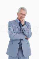 Mature tradesman in thinkers pose