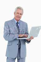 Smiling mature tradesman with his notebook