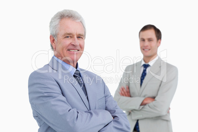 Smiling tradesmen with arms folded