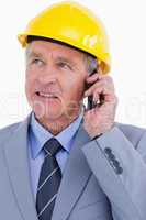 Close up of mature architect talking on the phone