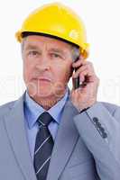 Close up of mature architect on his cellphone