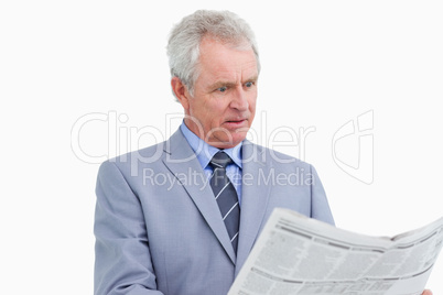 Mature tradesman surprised by the news paper