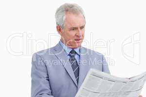 Mature tradesman surprised by the news paper