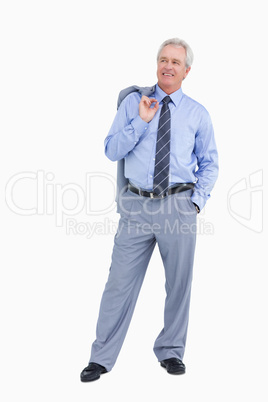 Smiling mature tradesman with jacket over his shoulder