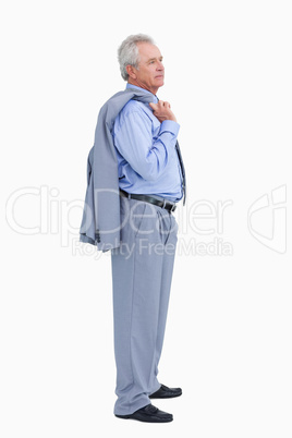 Side view of mature tradesman with jacket over his shoulder