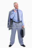 Mature tradesman standing with suitcase and jacket over his shou