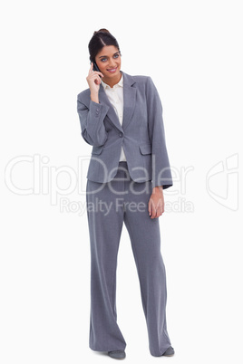 Smiling female entrepreneur having a conversation on the phone