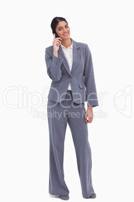 Smiling female entrepreneur on her cellphone