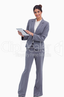 Smiling female entrepreneur with her tablet computer