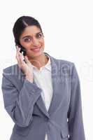 Smiling female entrepreneur on her cellphone