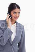 Smiling female entrepreneur on her mobile phone