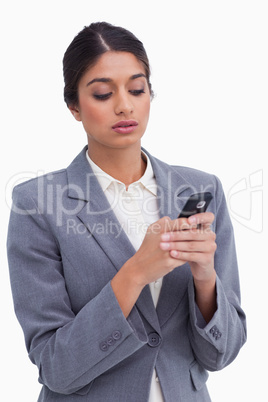 Female entrepreneur writing text message on her cellphone