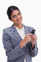 Smiling female entrepreneur with her cellphone