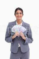 Smiling female entrepreneur with bank notes