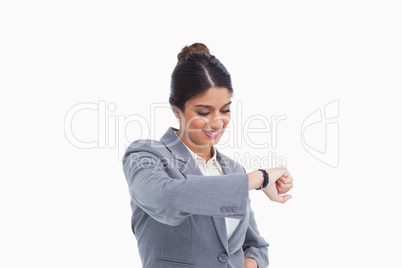 Smiling female entrepreneur looking at her watch
