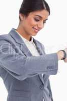Close up of female entrepreneur looking at watch