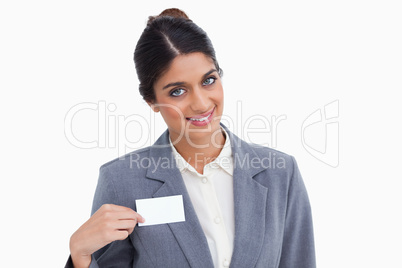 Smiling female entrepreneur pointing at name sign