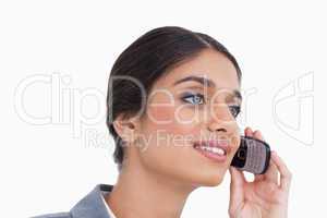 Close up side view of female entrepreneur on her cellphone