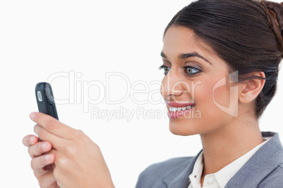 Close up side view of female entrepreneur reading text message