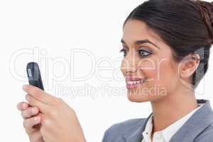 Close up side view of female entrepreneur reading text message
