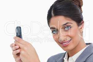 Close up of female entrepreneur with her mobile phone