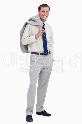 Smiling businessman with jacket over his shoulder