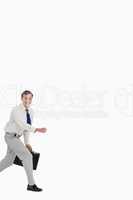 Businessman running with his suitcase
