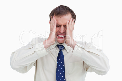 Close up of businessman with a headache