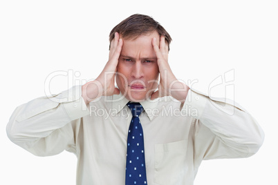 Close up of businessman experiencing a headache