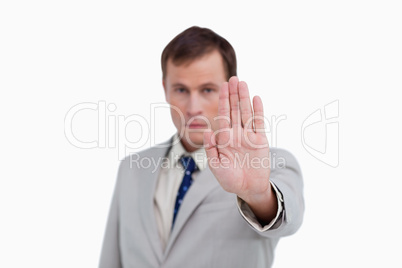 Close up of businessman's palm signalizing stop