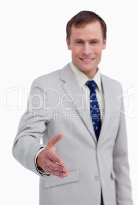 Hand being offered by smiling businessman
