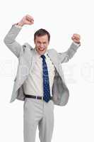 Cheering businessman with his arms up