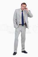 Businessman listening to caller on his mobile phone