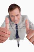 Close up of thumbs up given by businessman