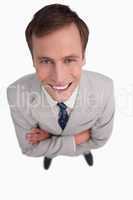 Close up of smiling businessman with his arms folded