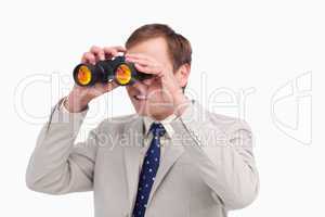 Businessman using spy glasses