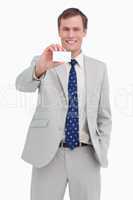 Smiling businessman presenting his business card