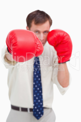 Close up of businessman's fist attacking