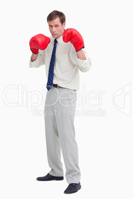 Businessman with his boxing gloves ready to fight