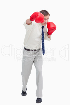 Businessman attacking with boxing gloves