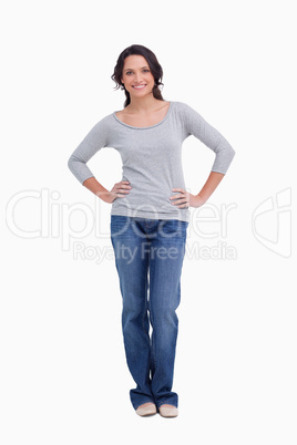 Smiling woman with hands on her hip