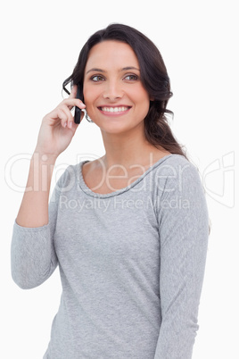 Close up of smiling woman on her mobile phone