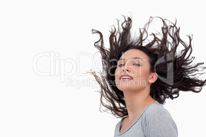 Sensual looking woman flipping her hair