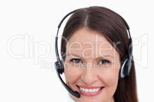 Close up of smiling female call center agent