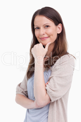 Close up side view of thoughtful smiling woman