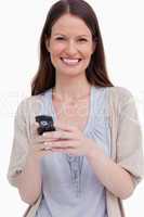 Close up of smiling woman with her cellphone